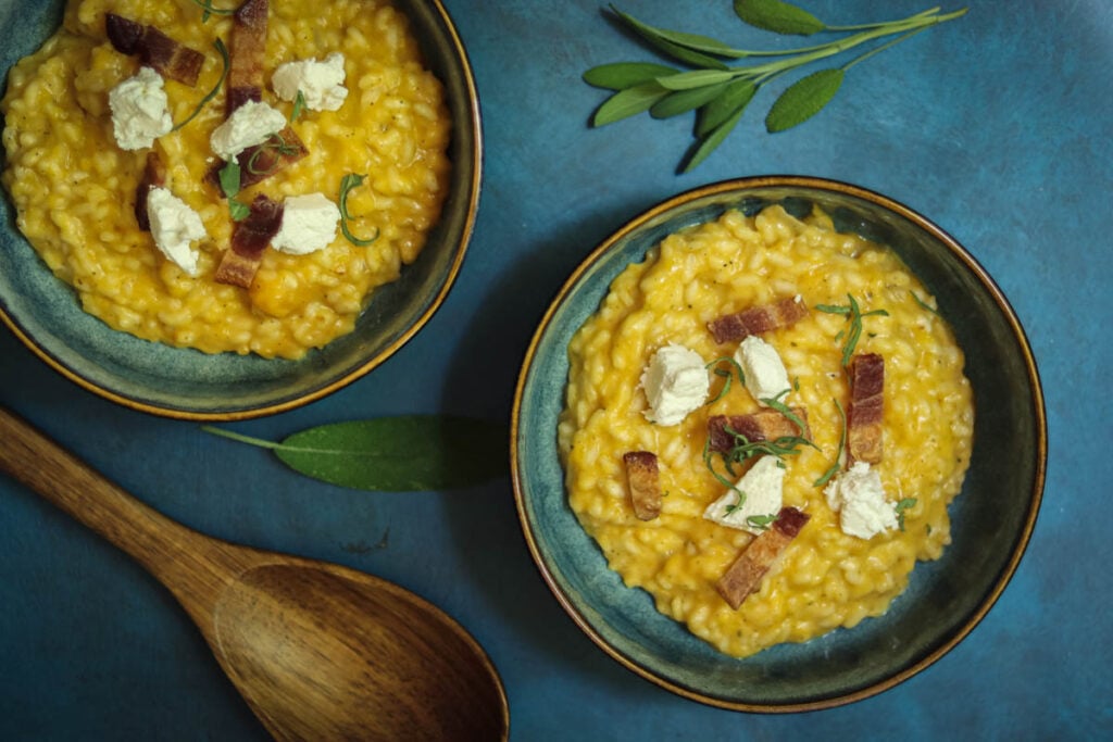 Two bowls of risotto with butternut squash.