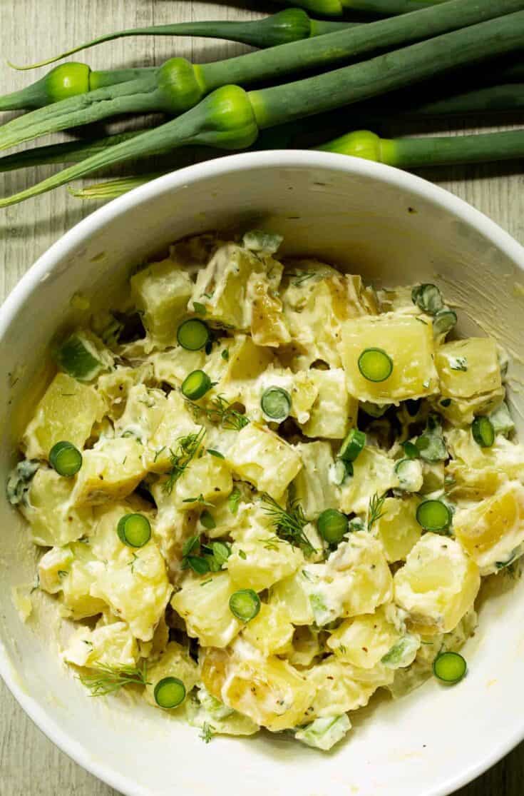 photo of leek scapes potato salad with leek scapes