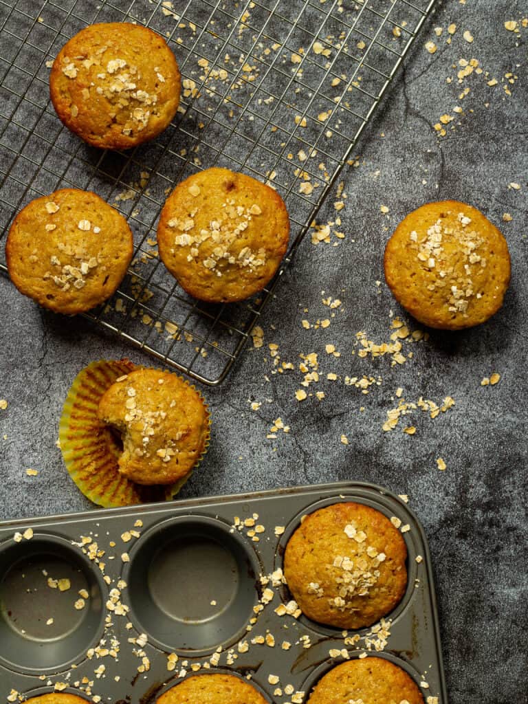 peanut butter banana oat muffins on a baking rack