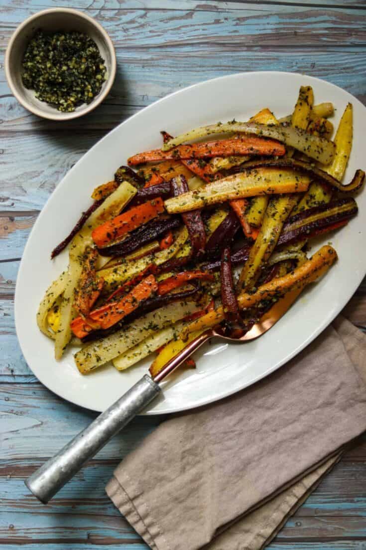 plate of rainbow carrots on a blue background