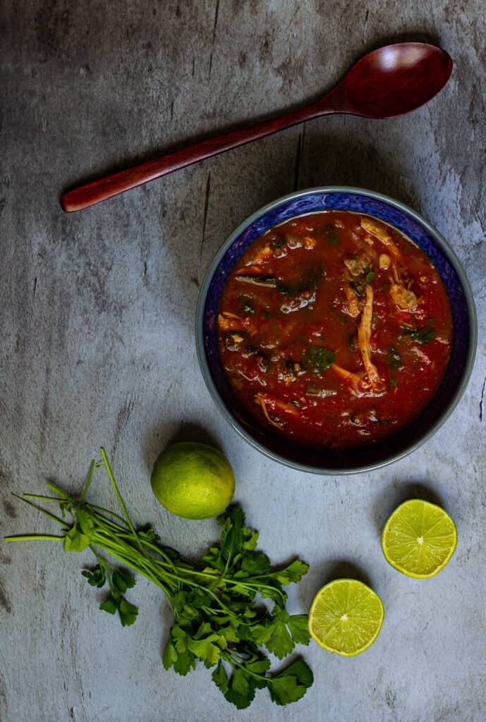 photo of soup with wooden spoon