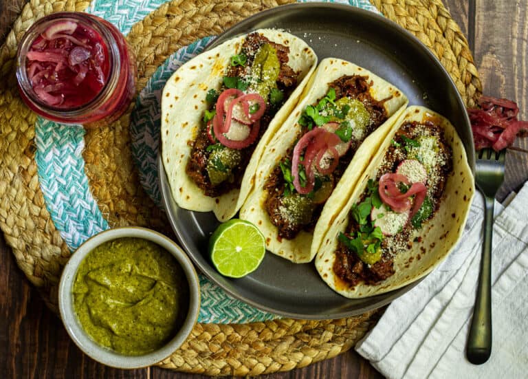 tacos with pickled red onion and poblano crema