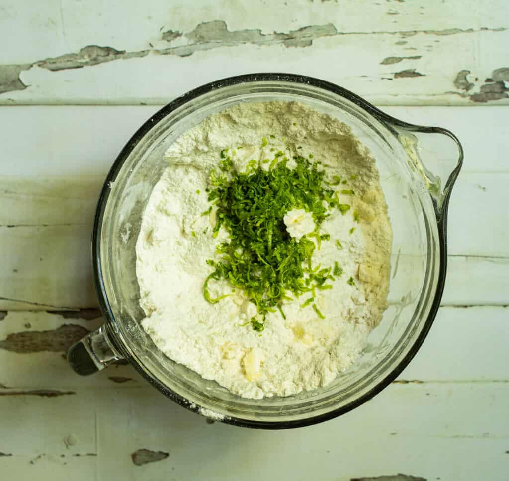 lime zest added to the bowl of flour and butter