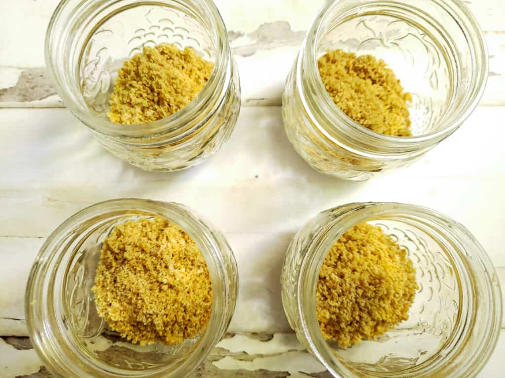 four jars of graham cracker crust