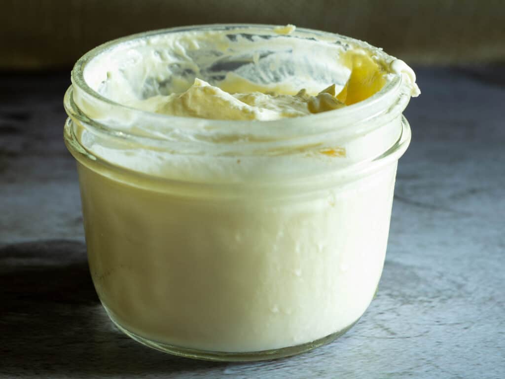close up of a jar of homemade creme fraiche