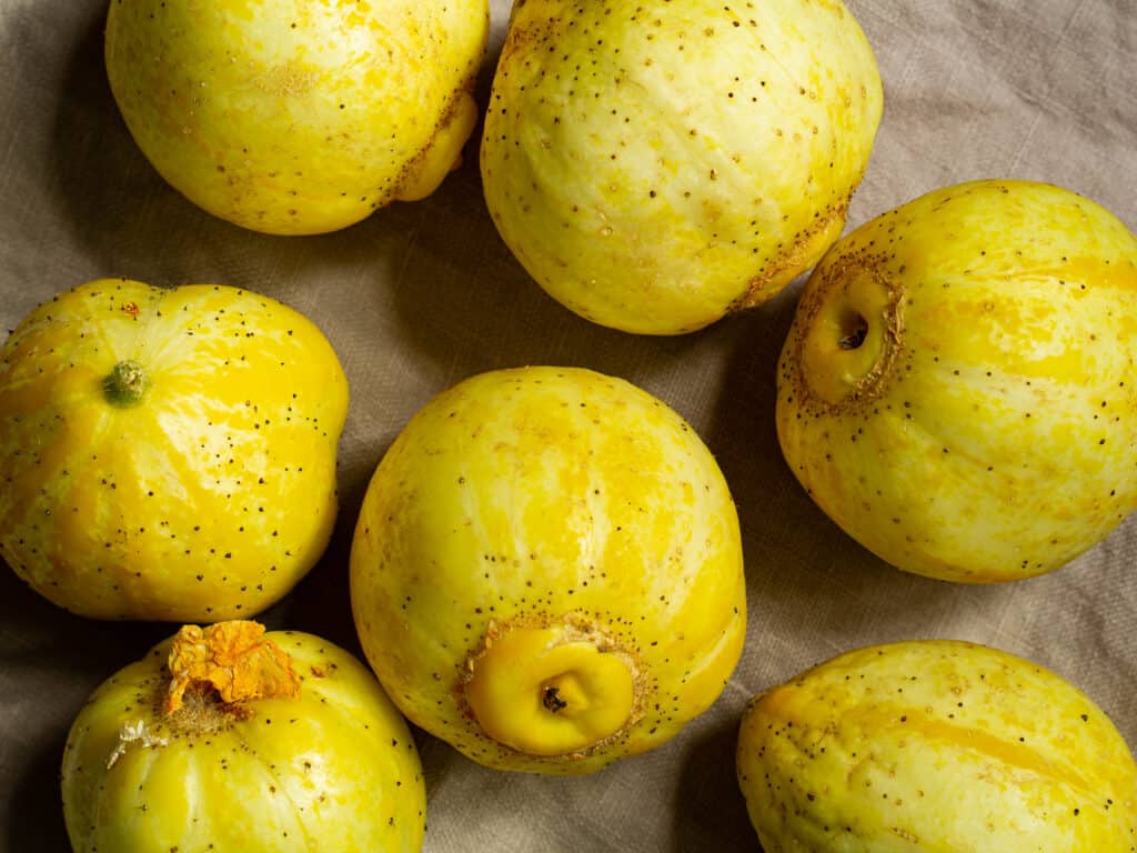 fresh lemon cucumbers on a light brown napkin