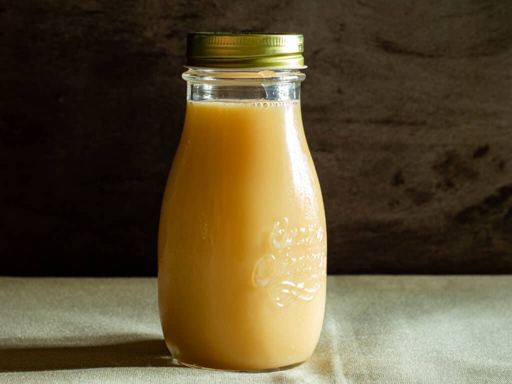 bottle of homemade sweetened condensed milk