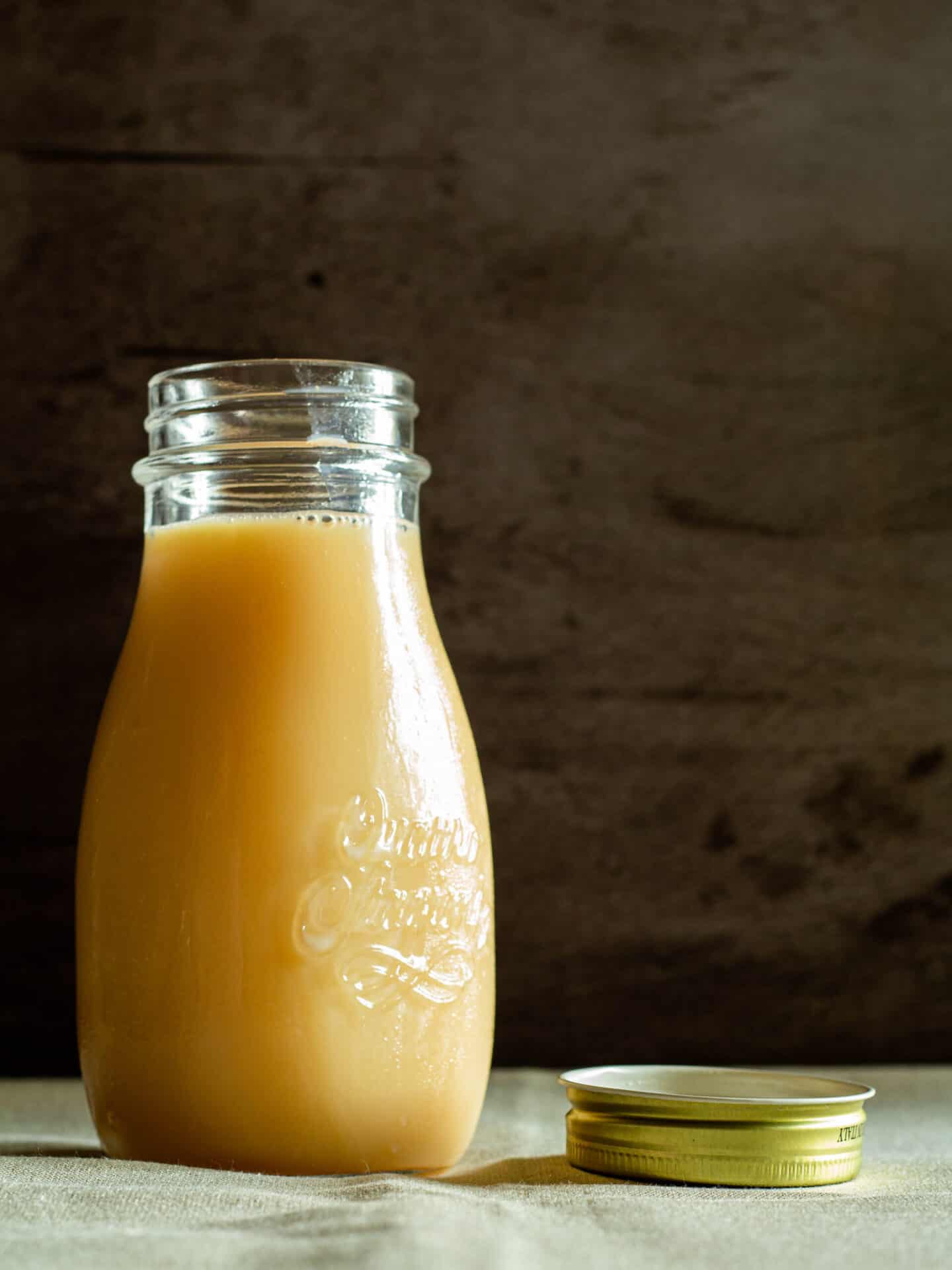 bottle of homemade sweetened condensed milk