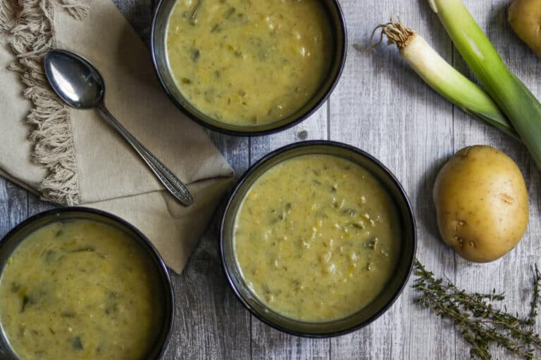 three bowls of leek and potato soup
