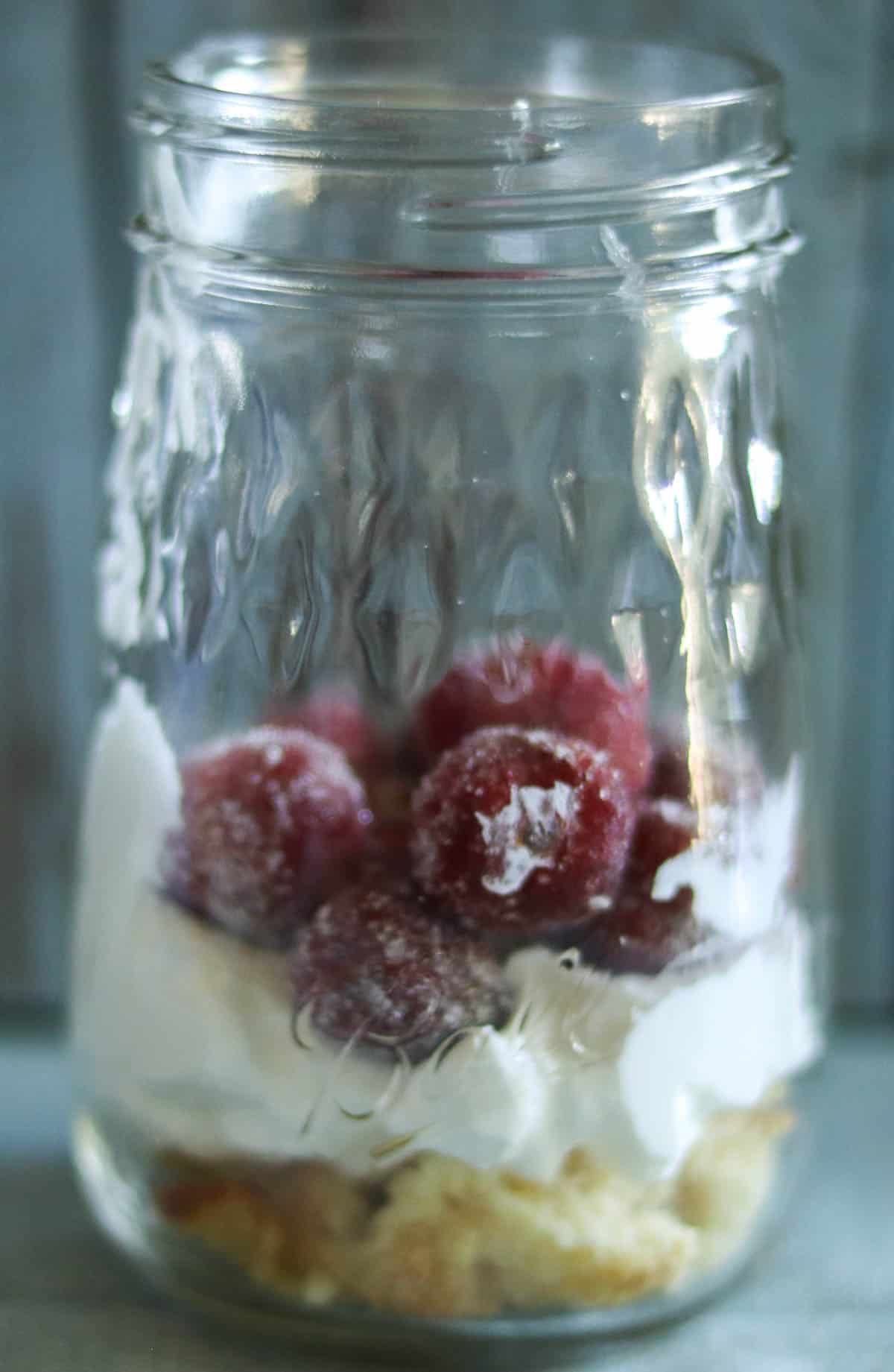 photo of adding strawberry shortcake ingredients to jars