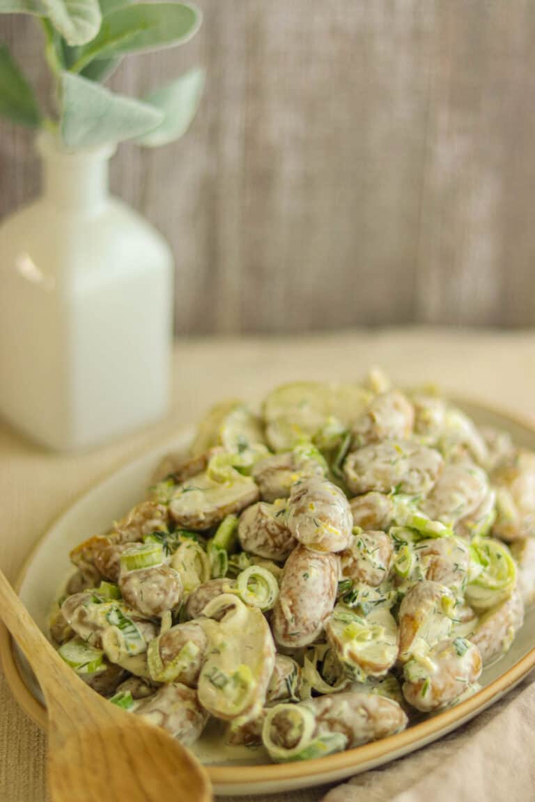 plate of potato salad with spring onions