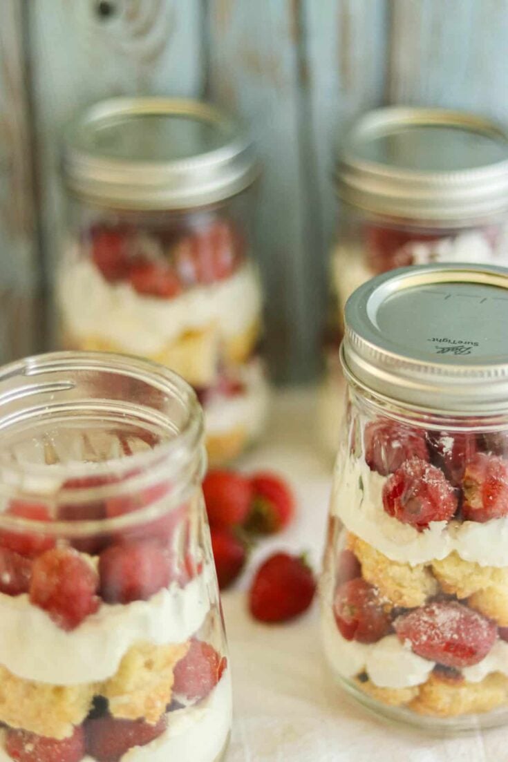 four jars with strawberry shortcake