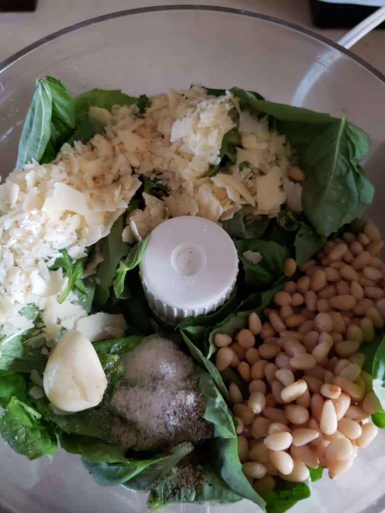 photo of all pesto ingredients in the food processor.