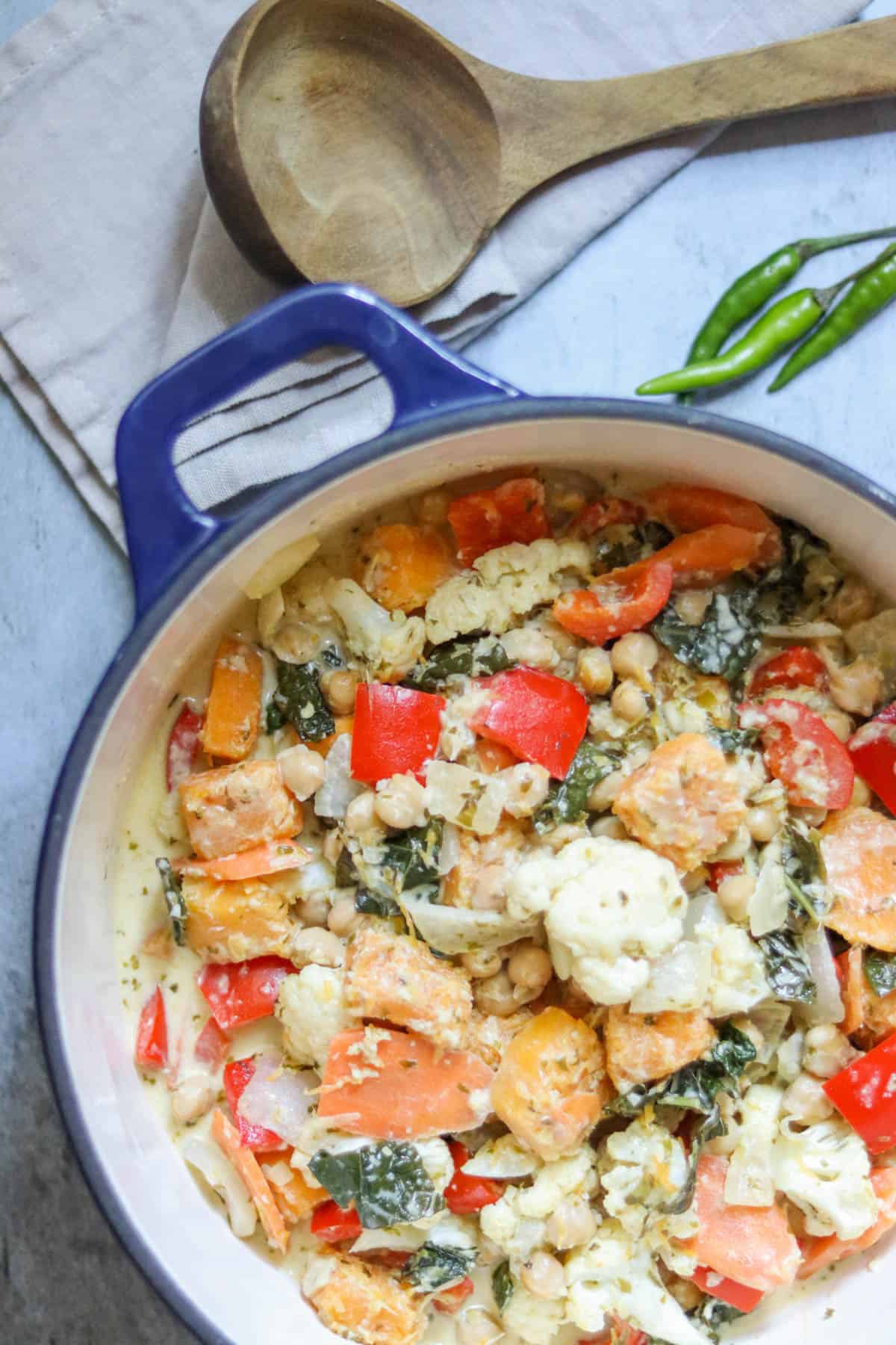 butternut squash and chickpea curry in a blue pot.