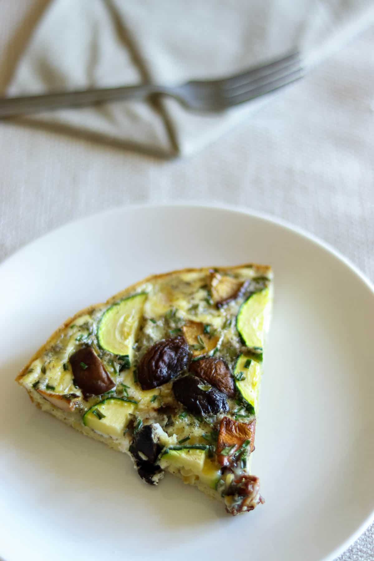 slice of frittata on a white plate.