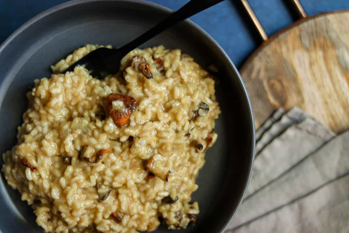 closeup photo of risotto in a gray bowl.