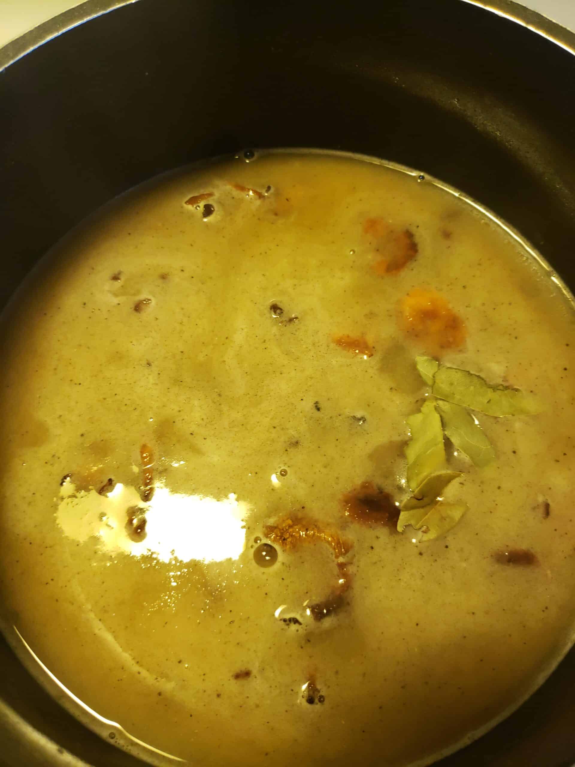 Stock added to the mushroom and flour mixture.