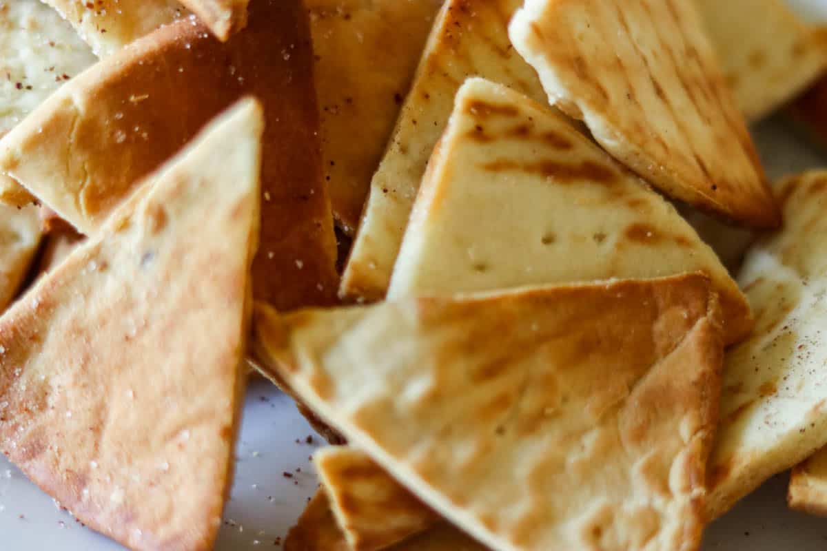 close up of pita chips cooked in an air fryer.