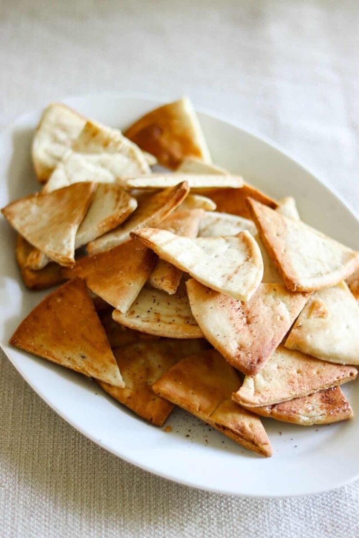 Air fried pita chips on a plate.