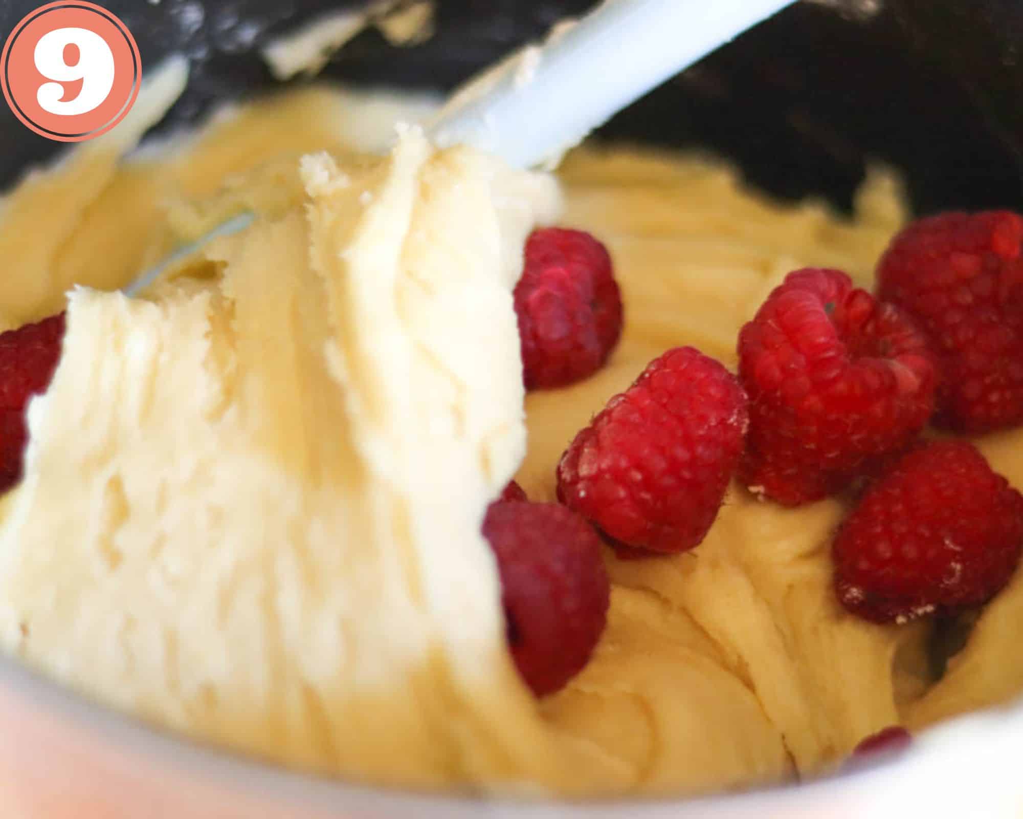 stirring the raspberries into the batter.