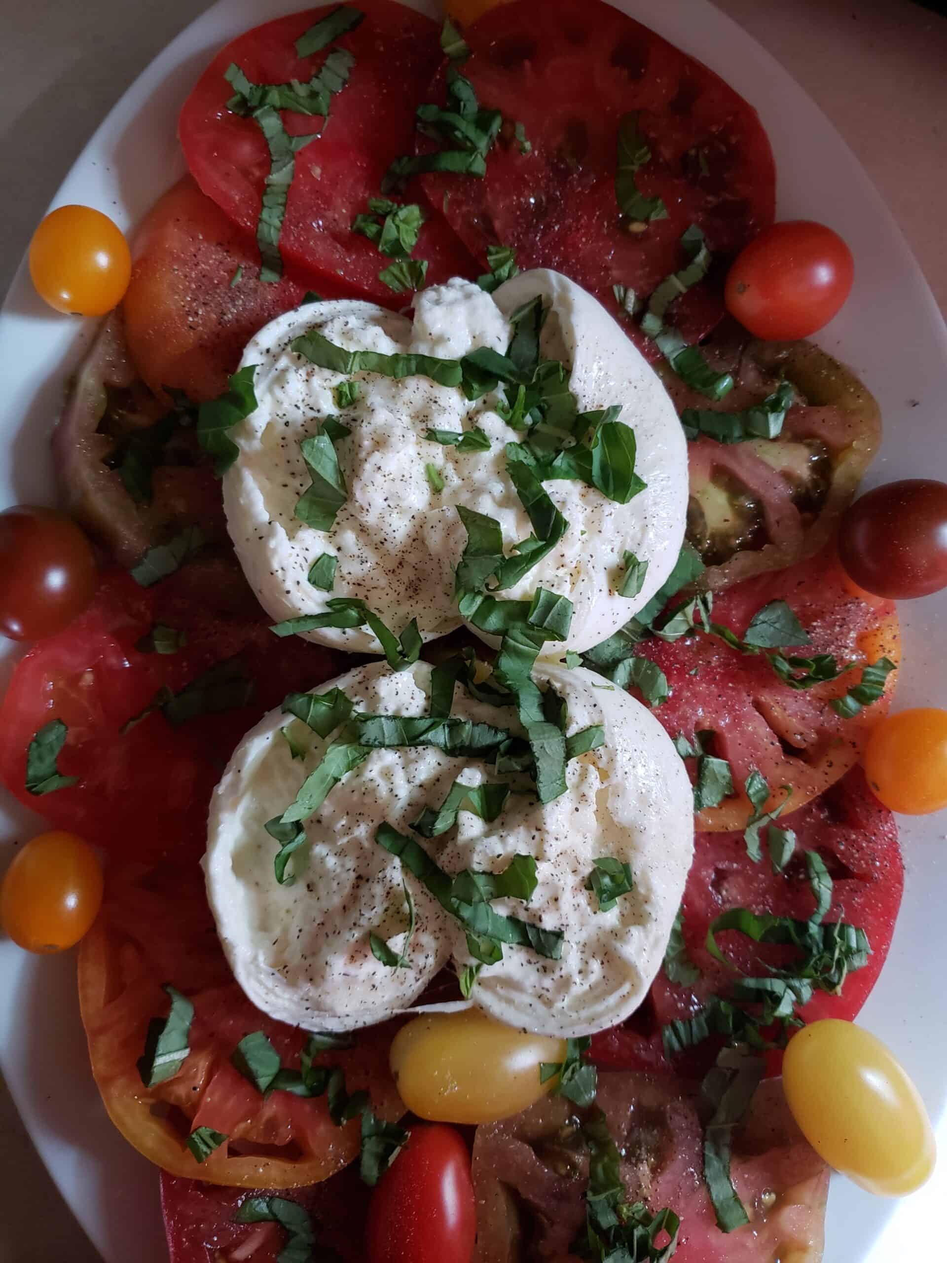 Photo of the salad after adding the other half of the basil and more salt and pepper.