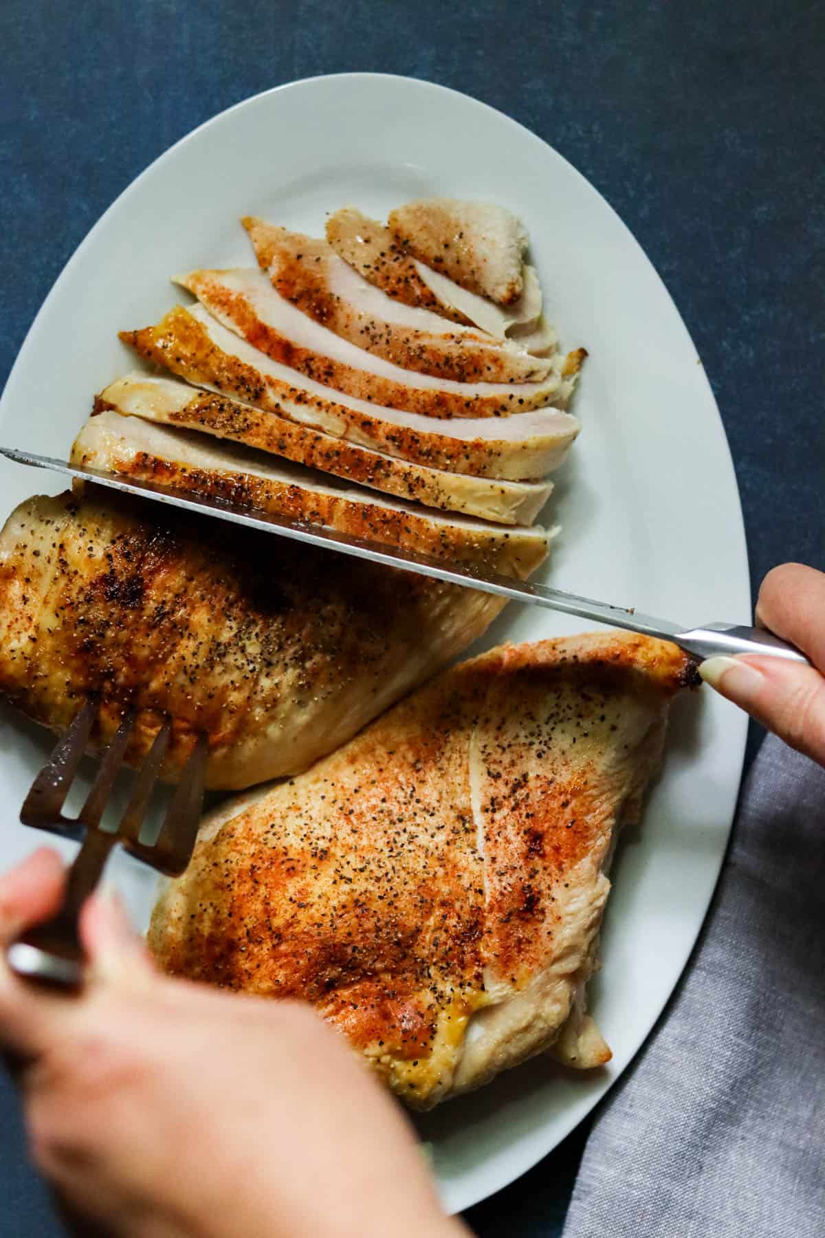 slicing turkey breast.