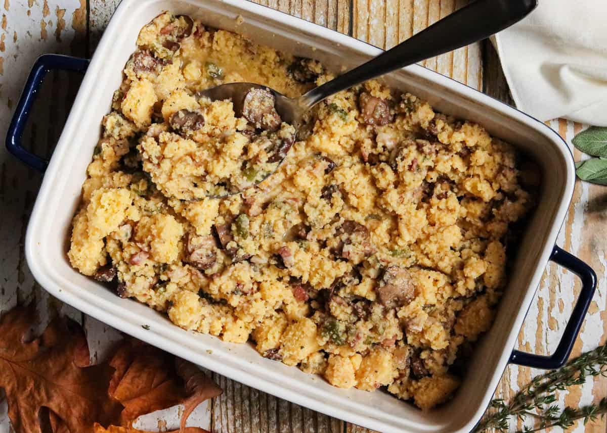Cornbread dressing in a white baking dish.