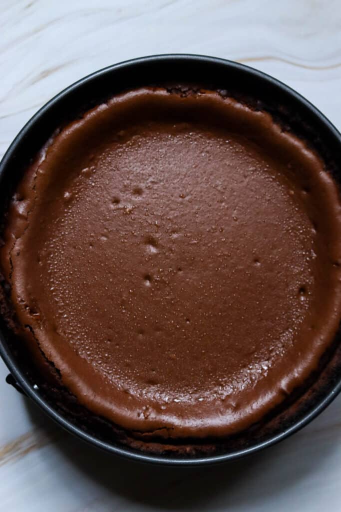 Chocolate orange cheesecake after baking.