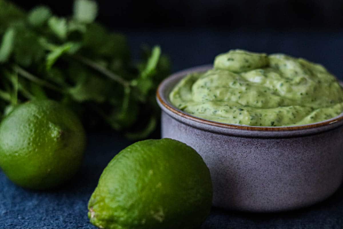 Dish of cream with limes.
