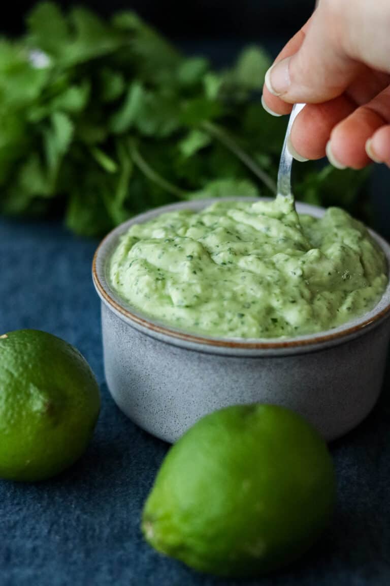 Stirring avocado lime crema.