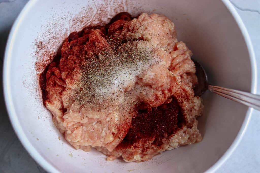 Seasonings added to the ground chicken.