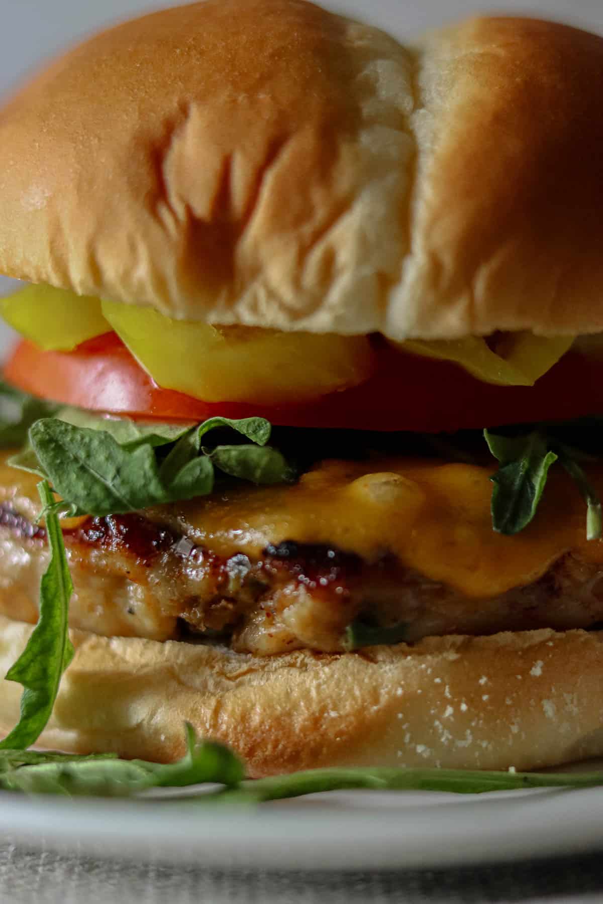 Spicy chicken burger on a brioche bun.