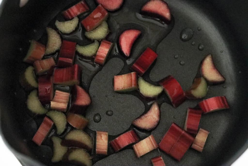 Rhubarb in a saucepan with water.