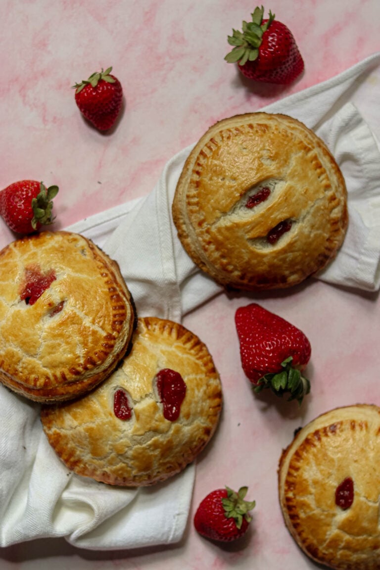 Four hand pies with a white napkin.