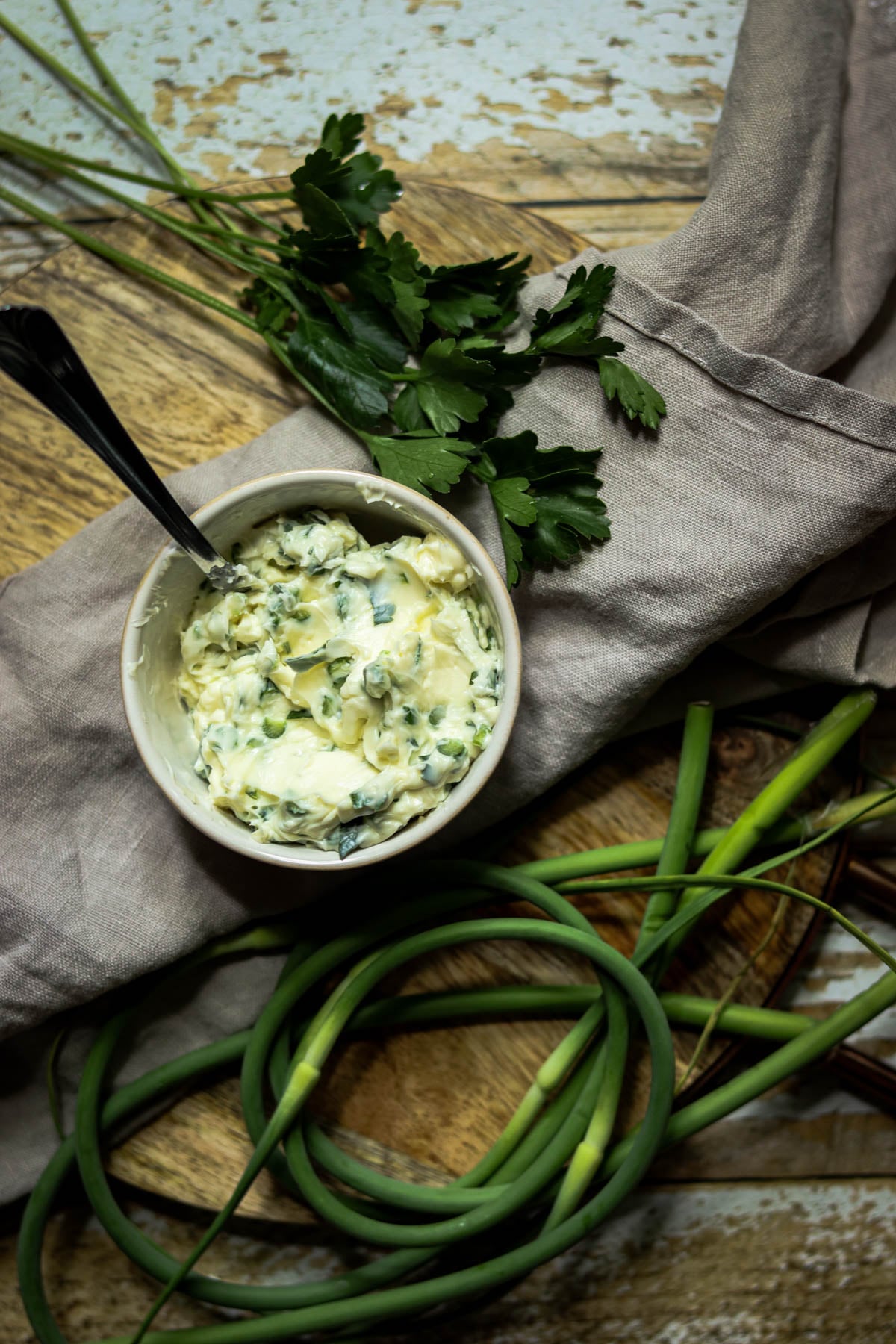 Garlic scape butter in a white bowl.