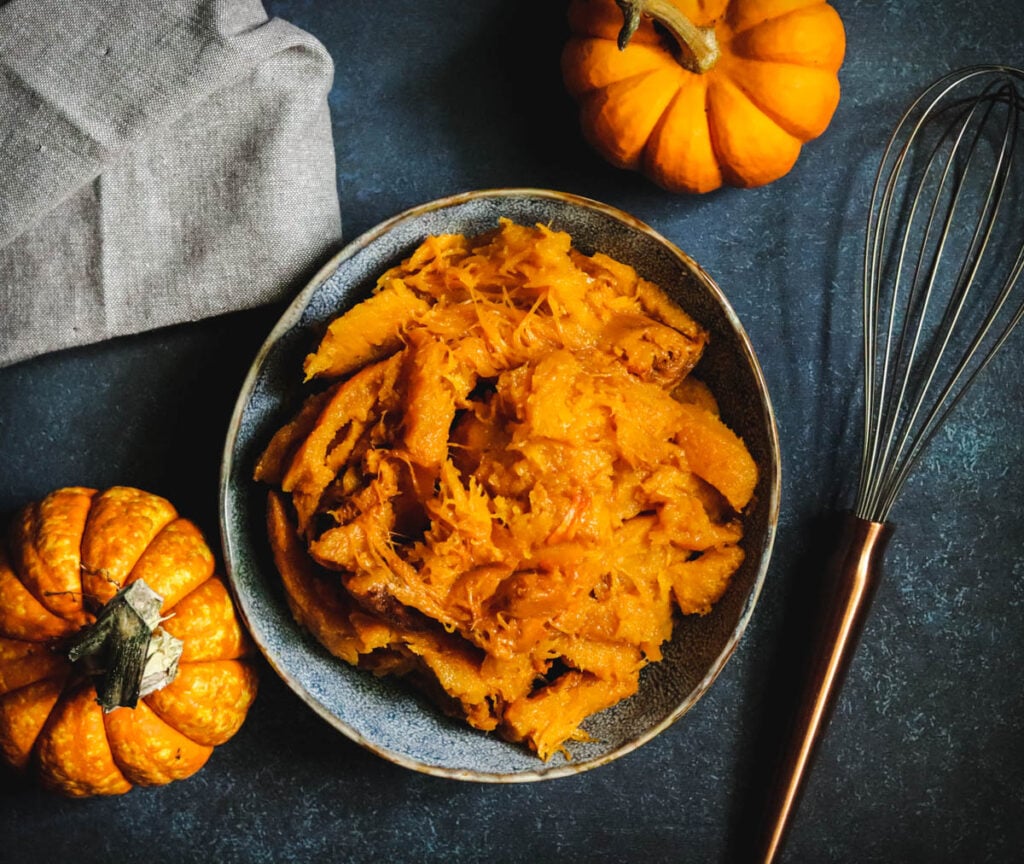 Homemade pumpkin puree with a whisk.
