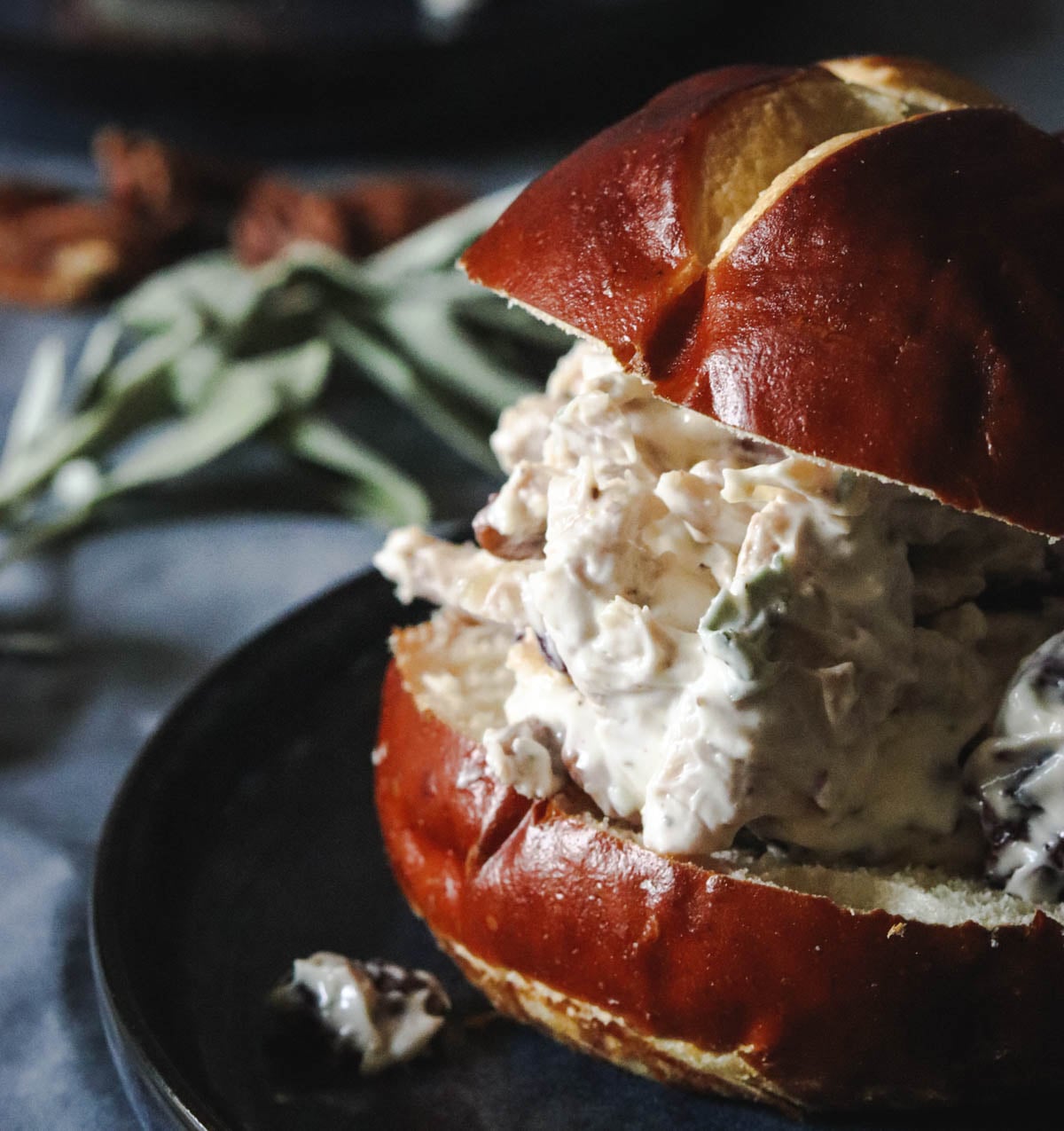 Leftover turkey salad sandwich on a blue plate.