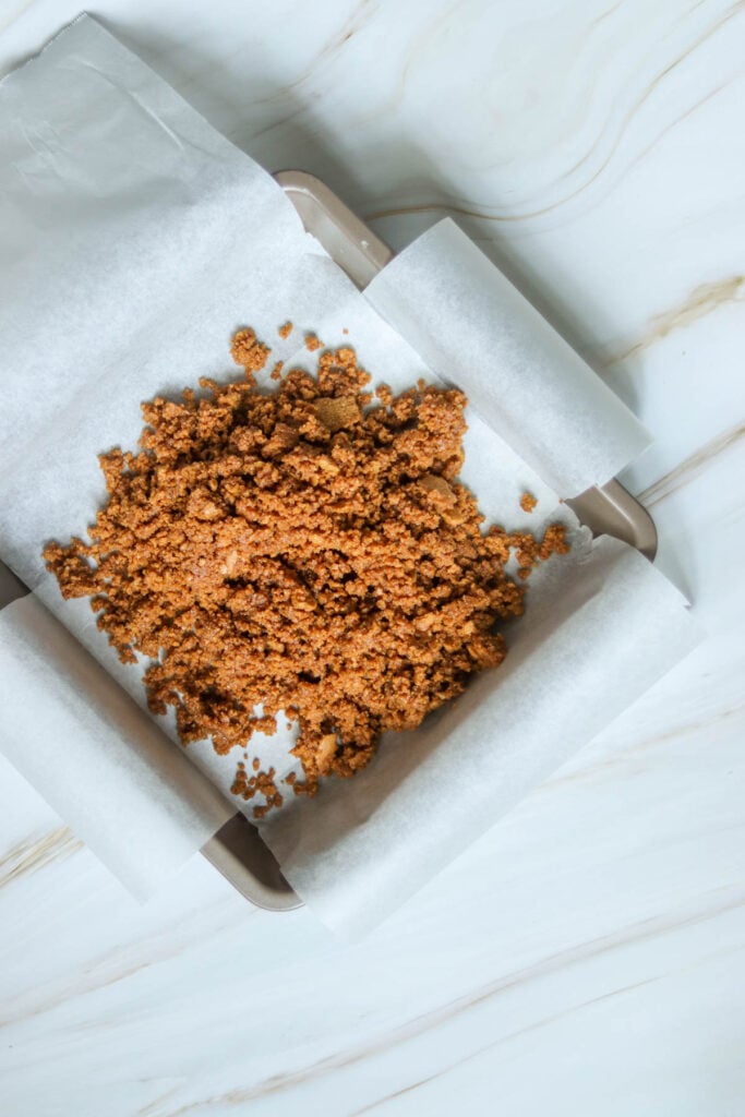 Gingersnap crumbs in a pan.