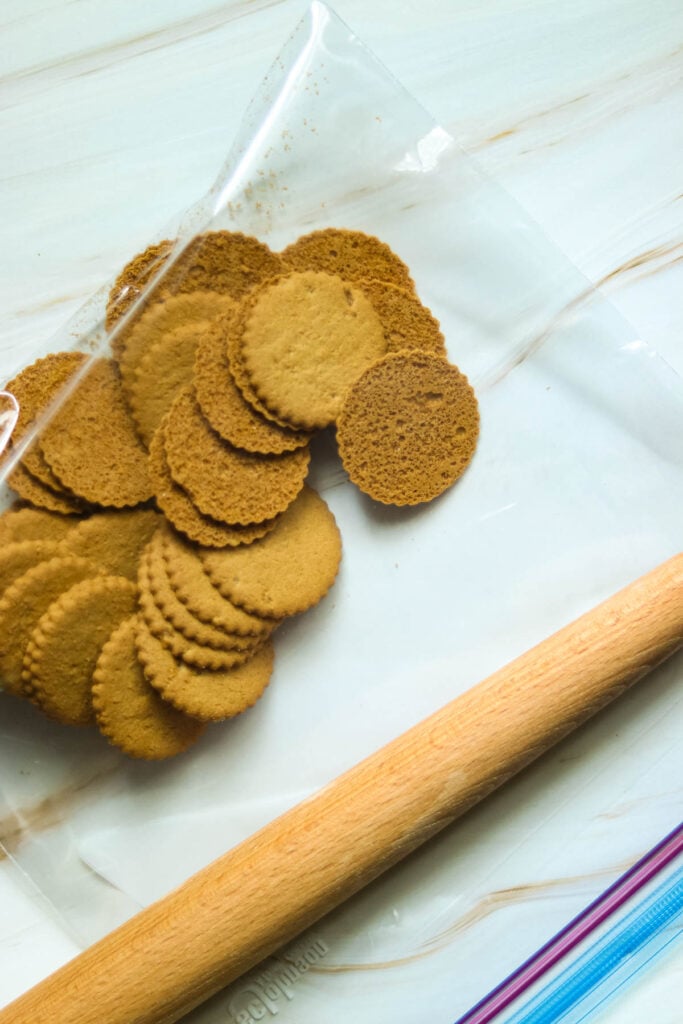 Gingersnaps in a bag with a rolling pin.