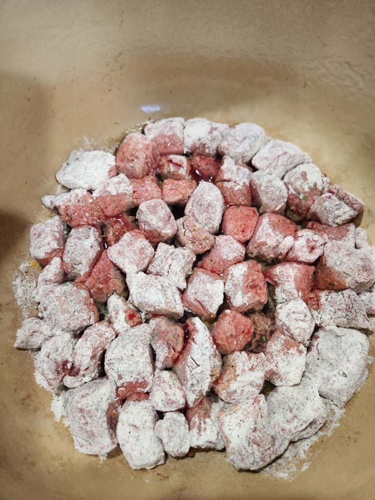 Photo of the stew meat browning in the Dutch oven.