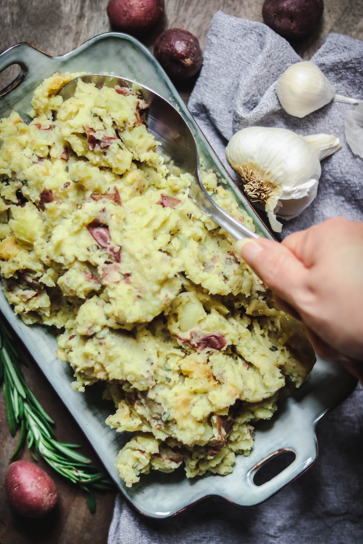 Mashed potatoes being scooped with a spoon.