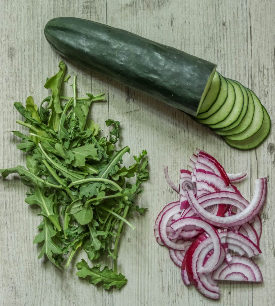 Cucumber, red onion, and arugula.