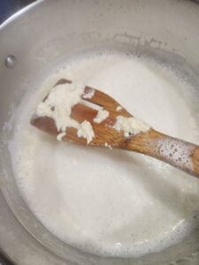 Curds forming after adding lemon juice.