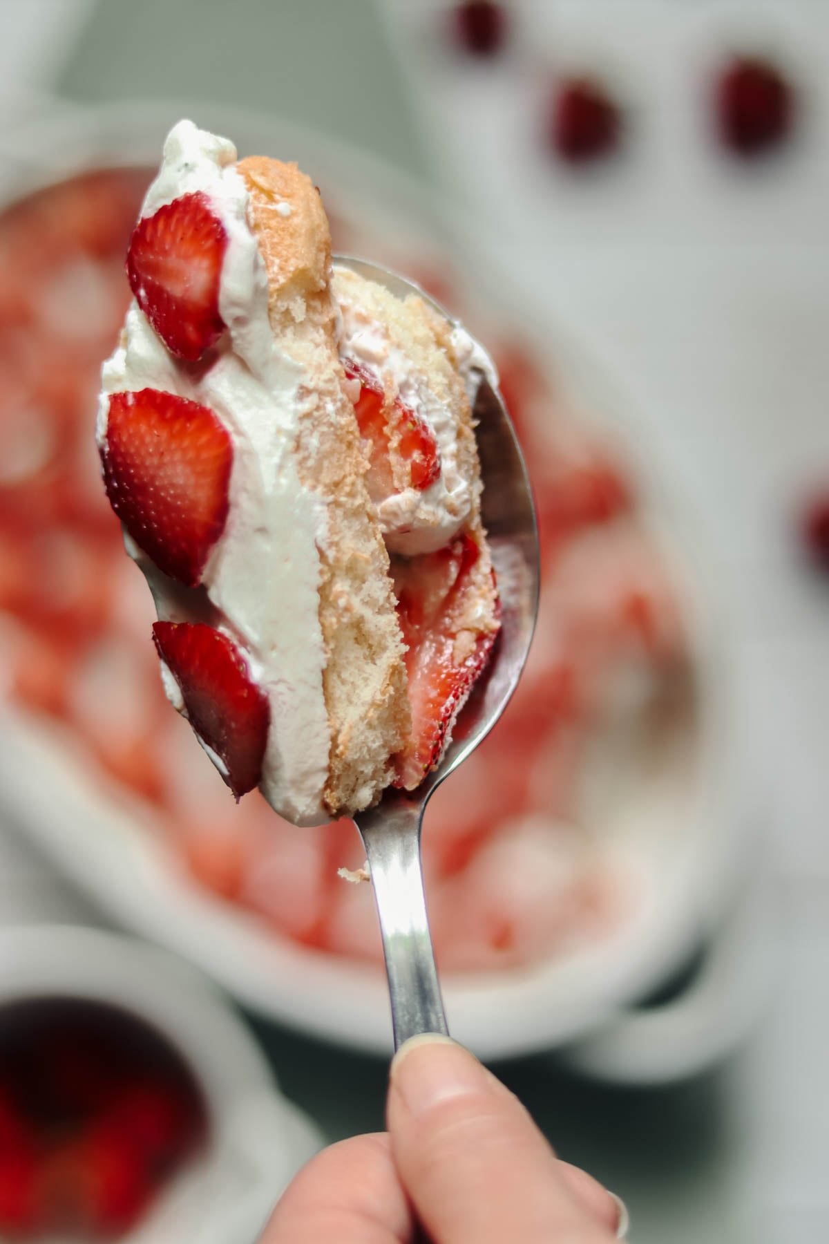 Spoonful of strawberry tiramisu.