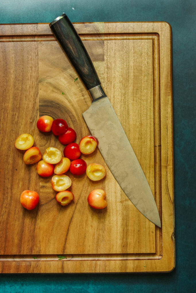Rainier cherries cut in half.