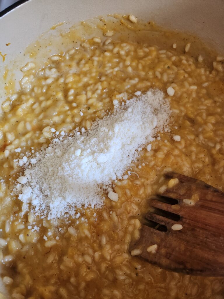 Adding pecorino romano.