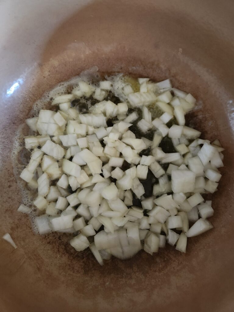 Chopped onions in Dutch oven.