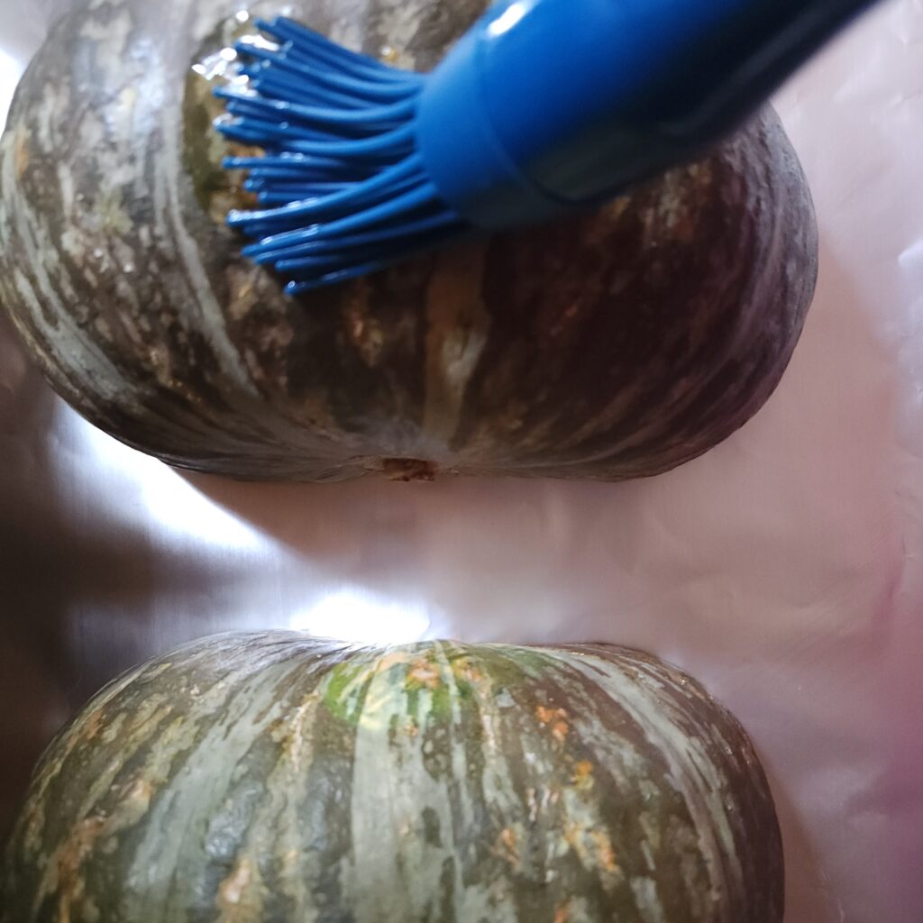Brushing oil on Kabocha squash.