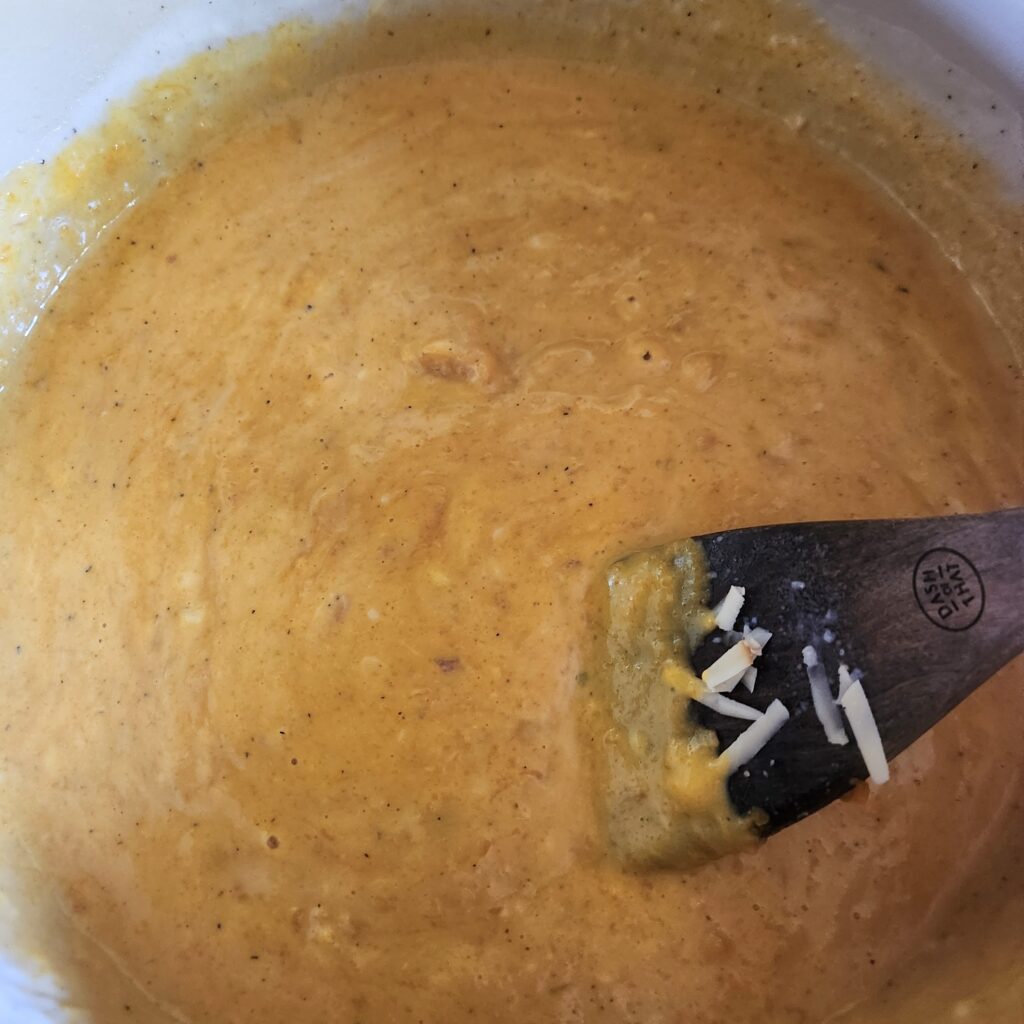 Stirring puree into the sauce.