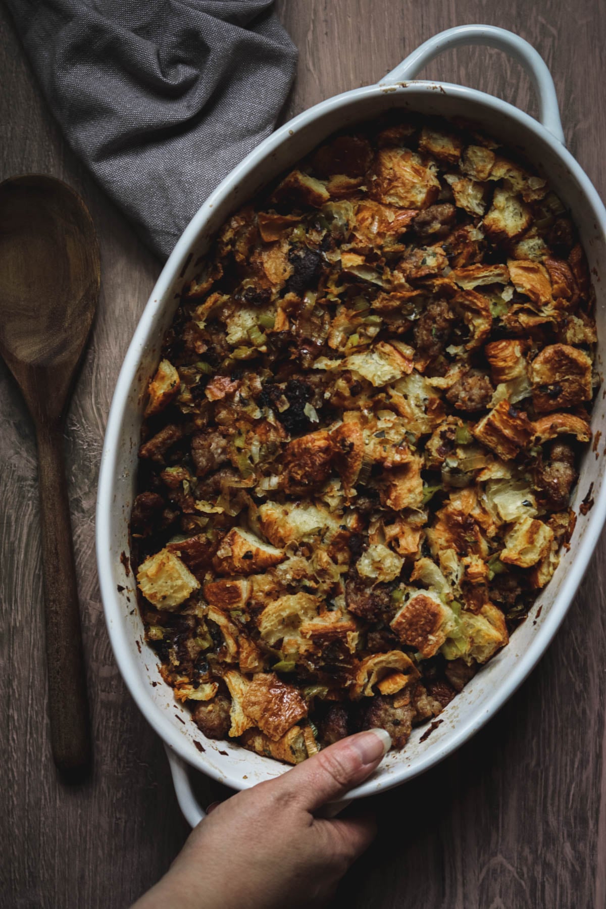White oval baking dish of stuffing.